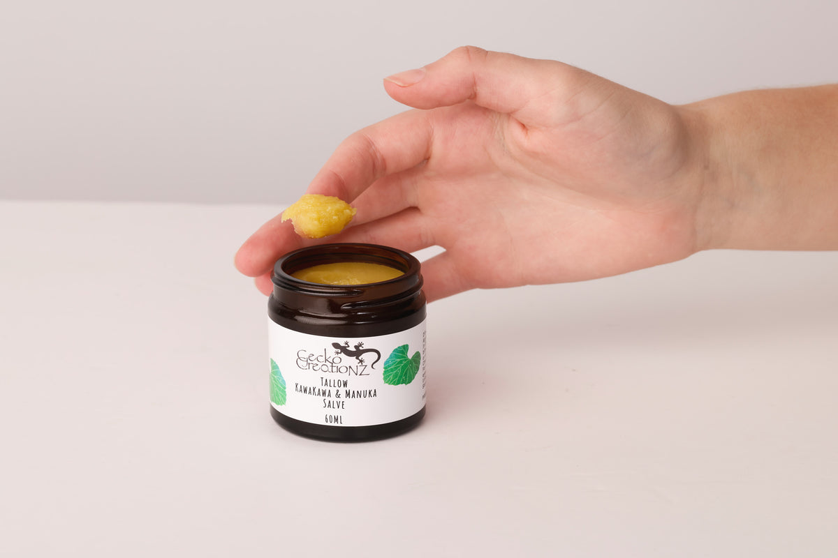 Scooping tallow kawakawa & manuka salve from the jar