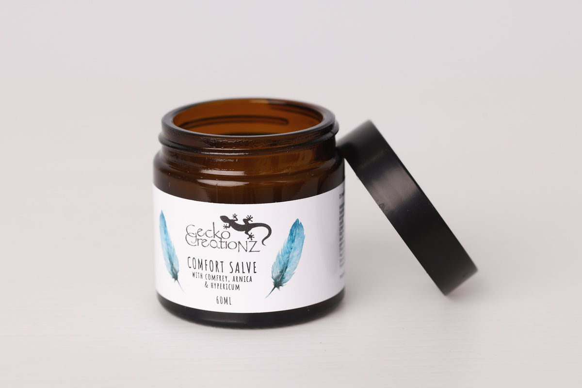 Comfort salve with comfrey, arnica and hypericum, open jar