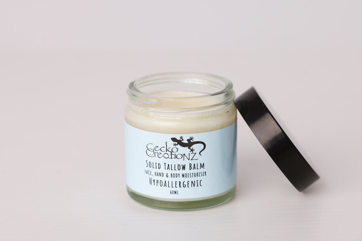 Solid tallow balm, unscented, open jar